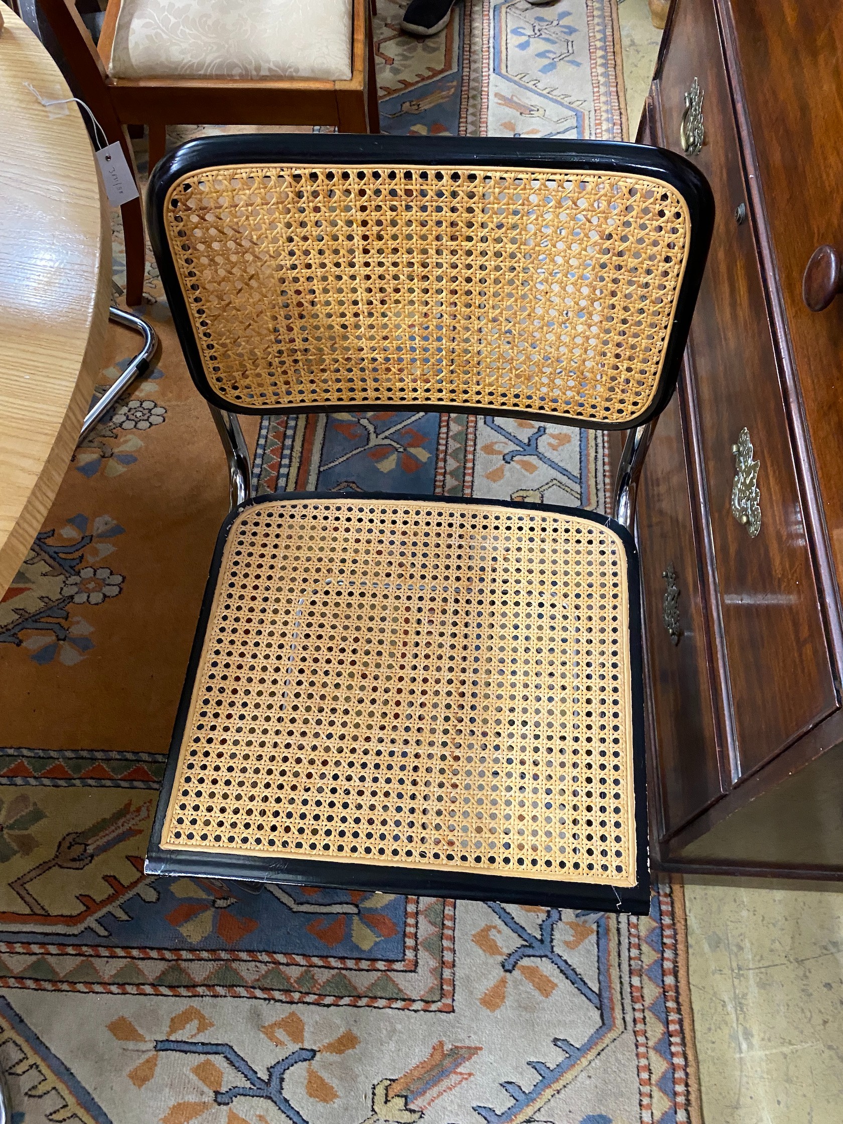 Six caned ebonized cantilever dining chairs in the style of Knoll Cesca by Marcel Breuer